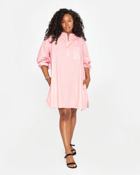 Candice wearing the Flamingo & Cream Stripe St Martin Dress with black sandals