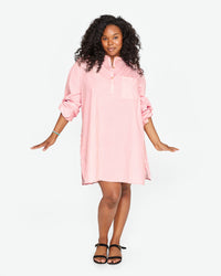 candice with the sleeves of the Flamingo & Cream Stripe St Martin Dress scrunched up