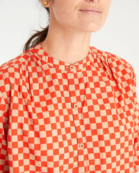 danica wearing the Poppy & Khaki Checker St. Martin Top. photo shows a detailed shot of the button placket