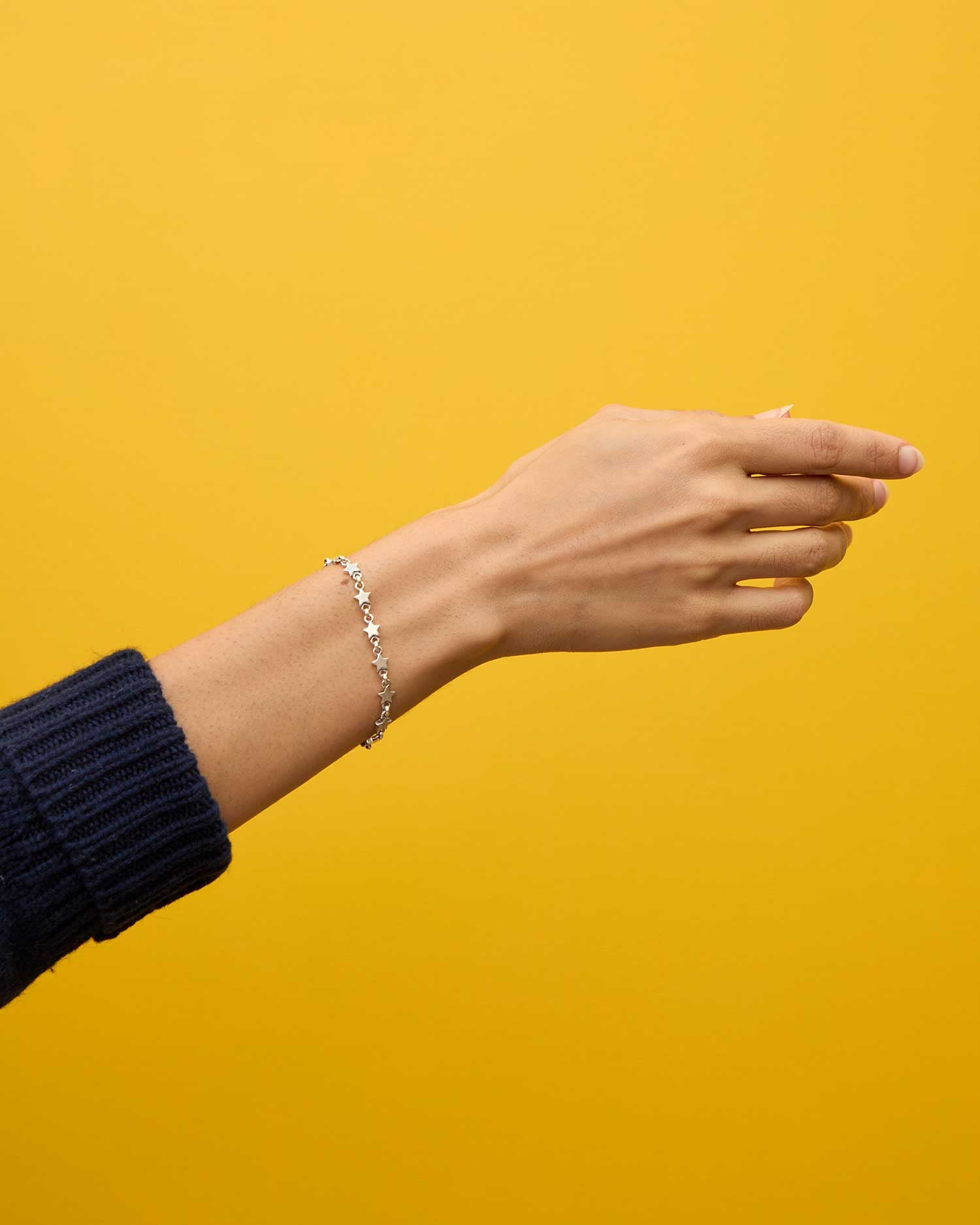 Haro wearing the Sterling Silver Star Strand Bracelet on her wrist