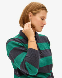 Sonnie wearing the Sterling Silver Star Strand Bracelet with the Heloise Polo