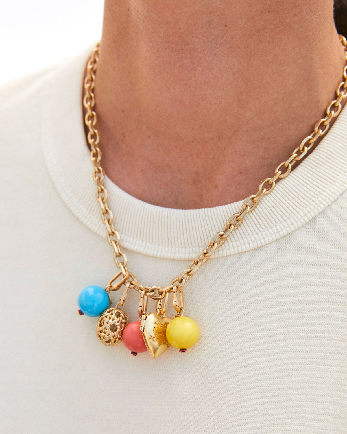 Vintage Gold Rattan Egg Charm Shown on the Charm Chain Necklace with the Turquoise Stone Bead Charm, Pink Stone Bead Charm,  CV x EMC Heart Locket Charm, and the Yellow Stone Bead Charm