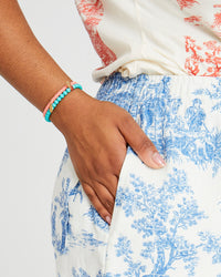 Candice wearing the Turquoise Stone Beaded Stretch Bracelet with the coral beaded disc stretch bracelet