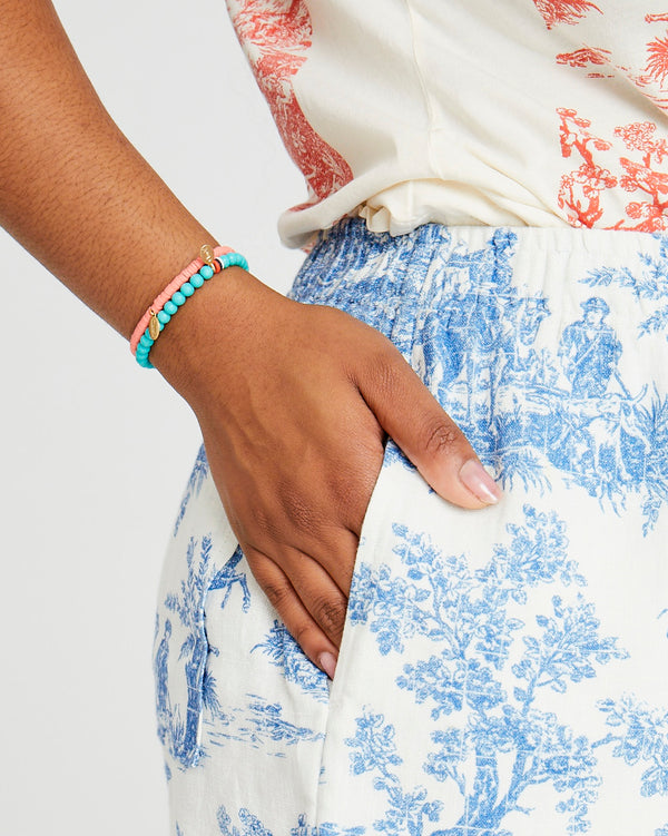 Candice wearing the Turquoise Stone Beaded Stretch Bracelet with the coral beaded disc stretch bracelet