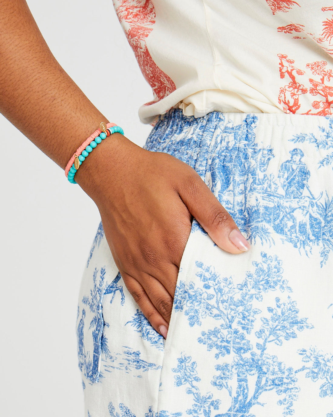 Candice wearing the Turquoise Stone Beaded Stretch Bracelet with the coral beaded disc stretch bracelet