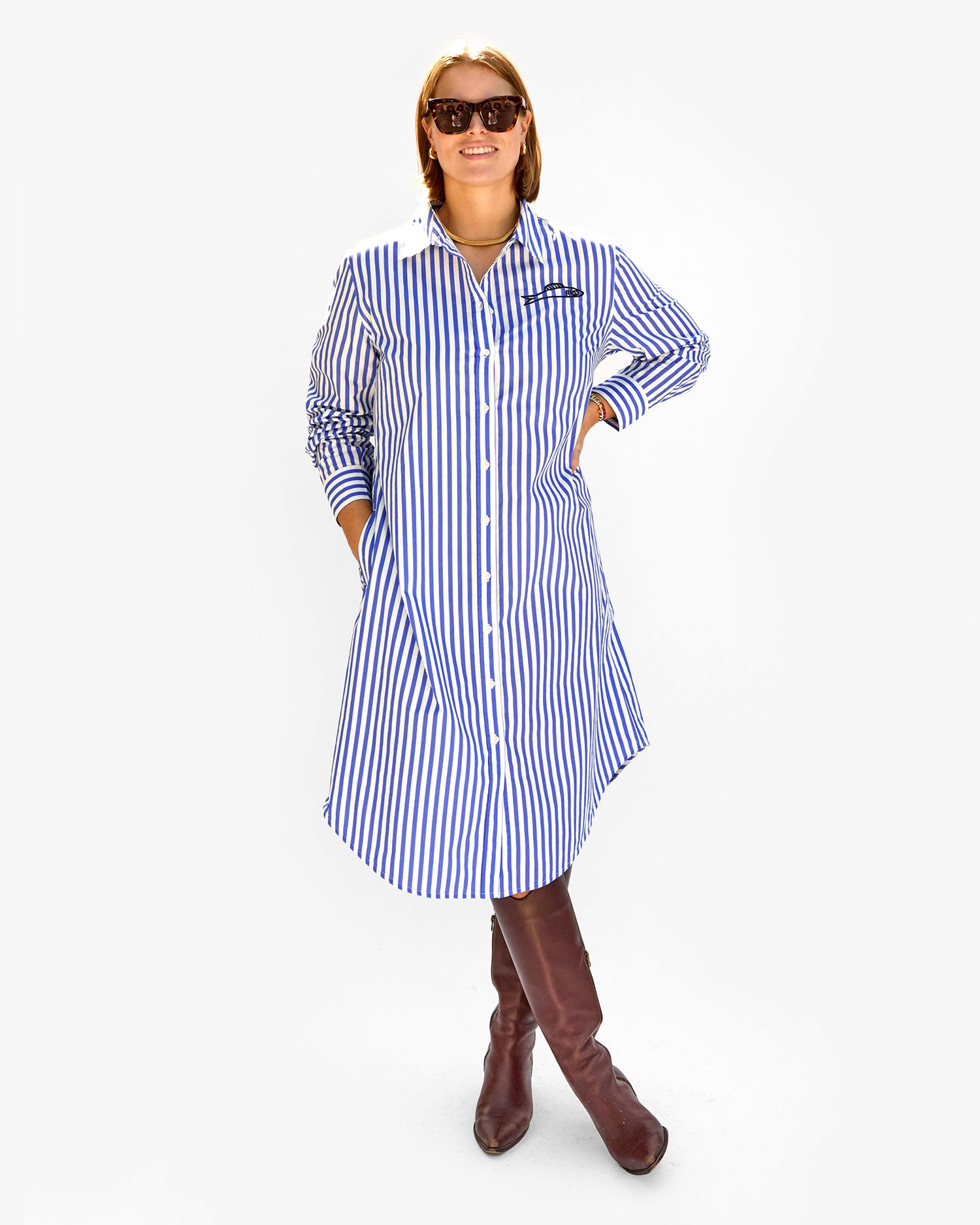 Sonnie wearing the Blue & Cream Stripe w/ Sardine Suzette Dress with tall brown boots