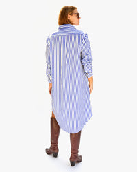 back view of Sonnie in the Blue & Cream Stripe w/ Sardine Suzette Dress with her tall brown boots