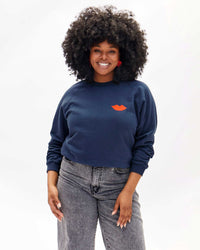 Candace wearing the Navy with Poppy Lips Sweatshirt with Grey Jeans