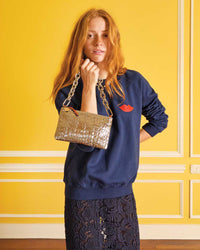 Haley wears our Bisous Sweatshirt in Navy
