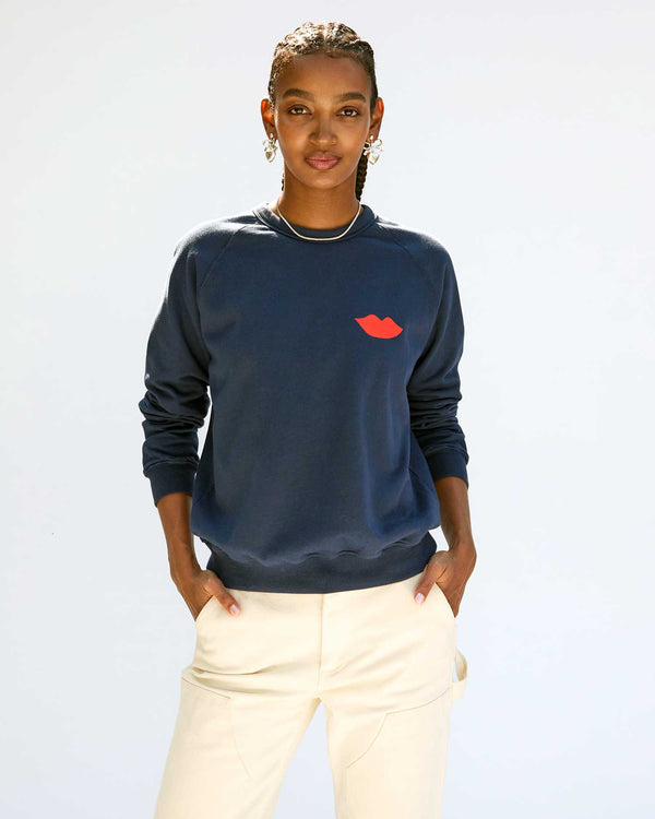 Jordan wears our Bisous Sweatshirt in Navy