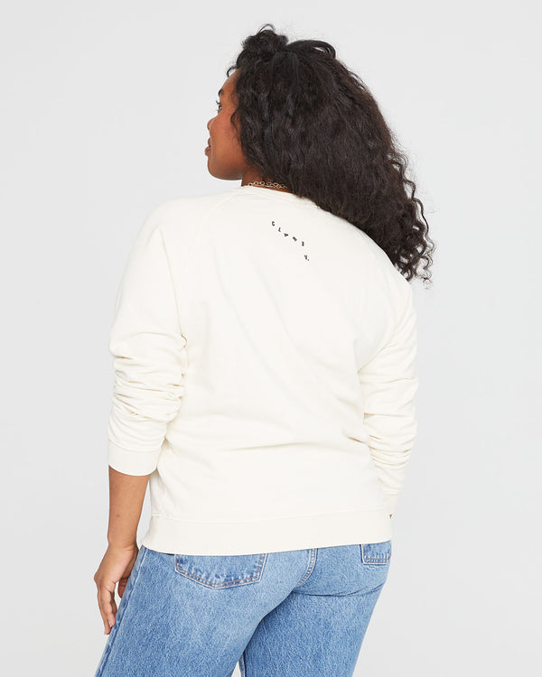 back view of candice in the Sweatshirt in Cream with Valle de Loire with jeans