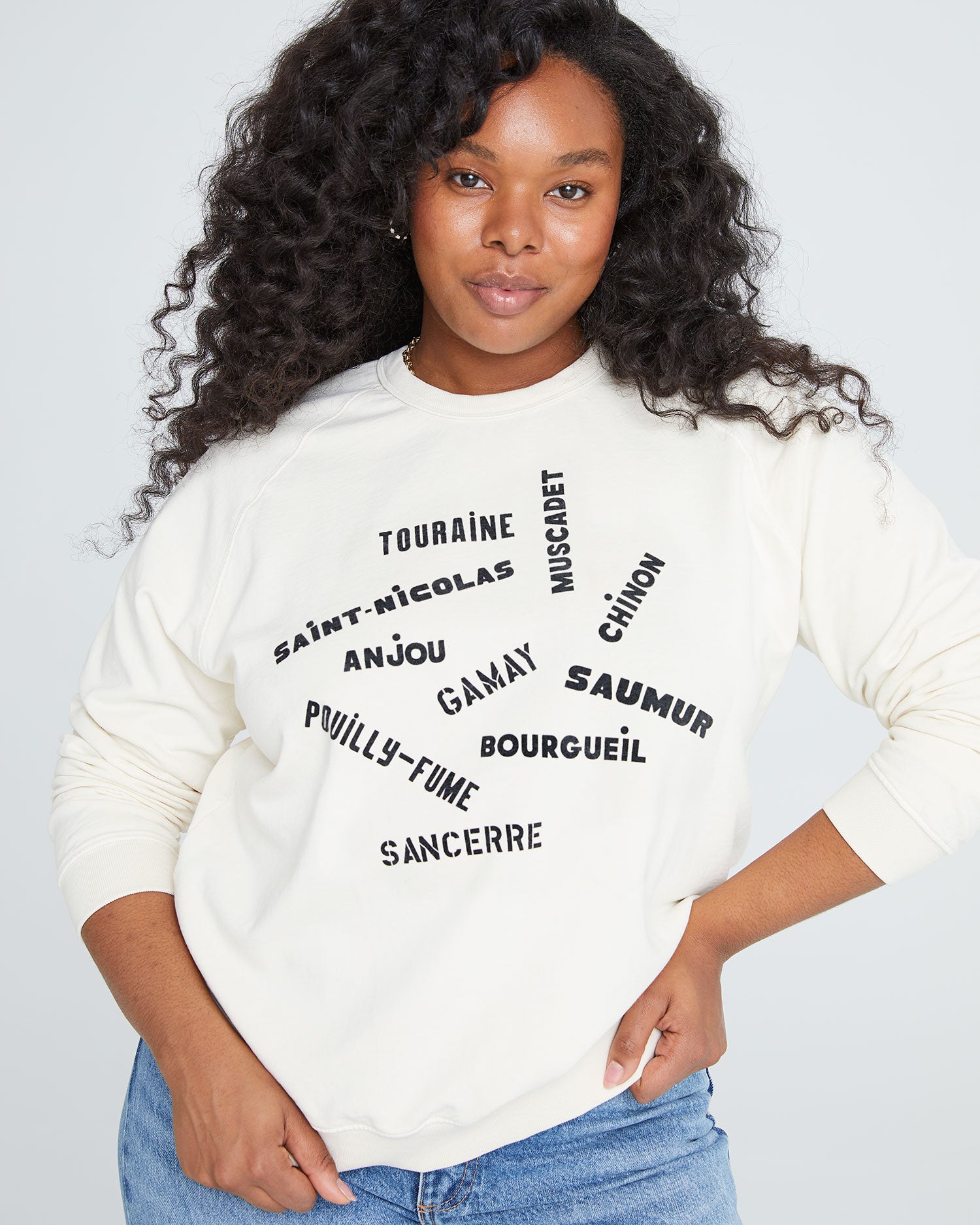 candice wearing the Sweatshirt in Cream with Valle de Loire with jeans