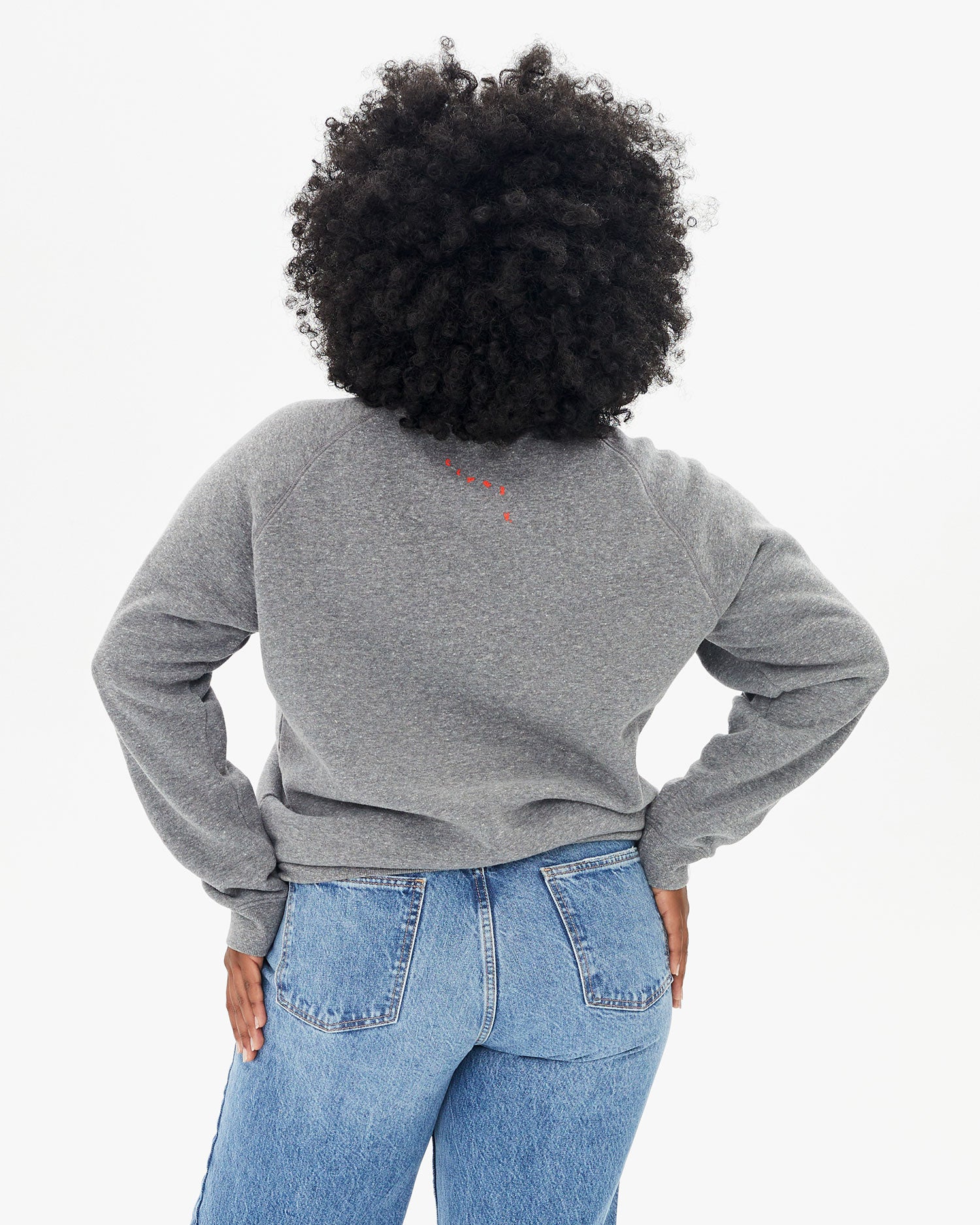 back view of candice in the Heather Grey Oui Sweatshirt with jeans
