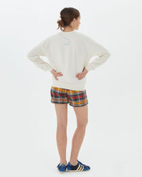 back view of Zoe in the Sweatshirt in Cream w/ Passer le Filet