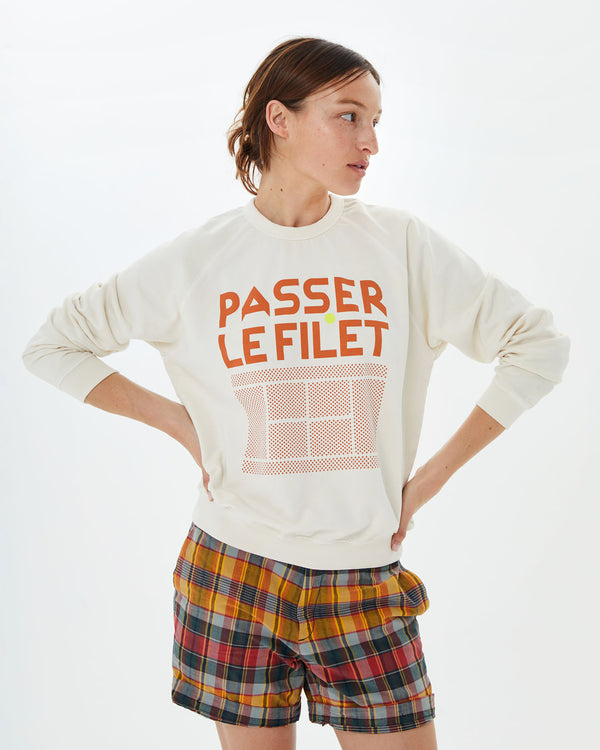 Zoe wearing the Sweatshirt in Cream w/ Passer le Filet with plaid shorts