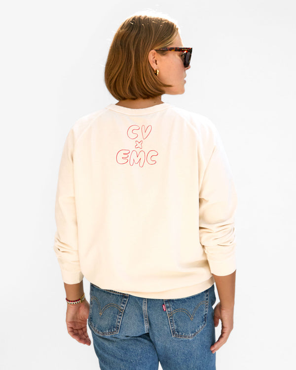 back view of Sonnie wearing the Cream w/ Liberté Ègalité Maternité Sweatshirt with jeans