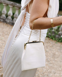 Sophie holding The Patricia seen from the side