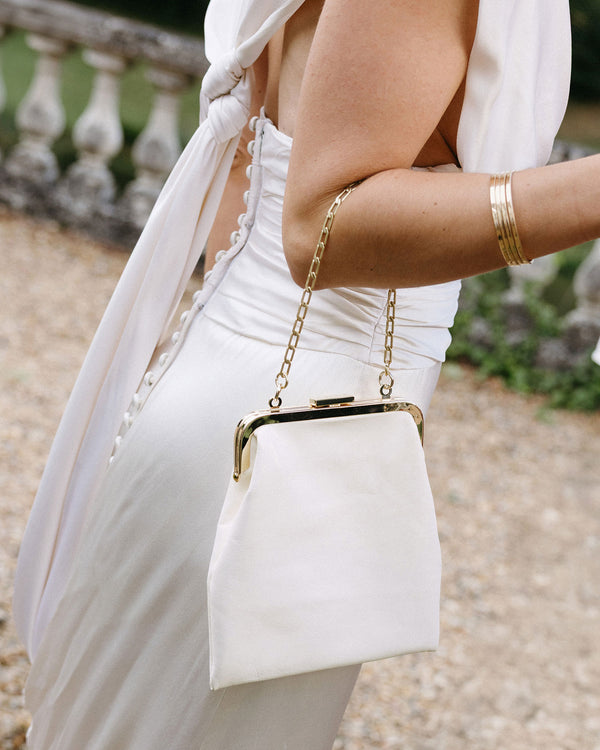 Sophie holding The Patricia seen from the side