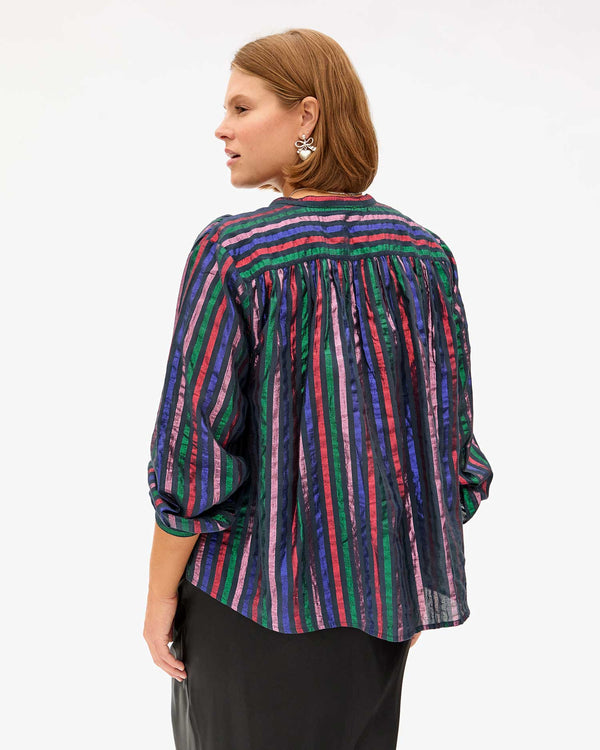 back view of Sonnie in the Multi Stripe Thea Blouse