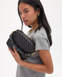 Sandra holding Midi Sac with Top Handle