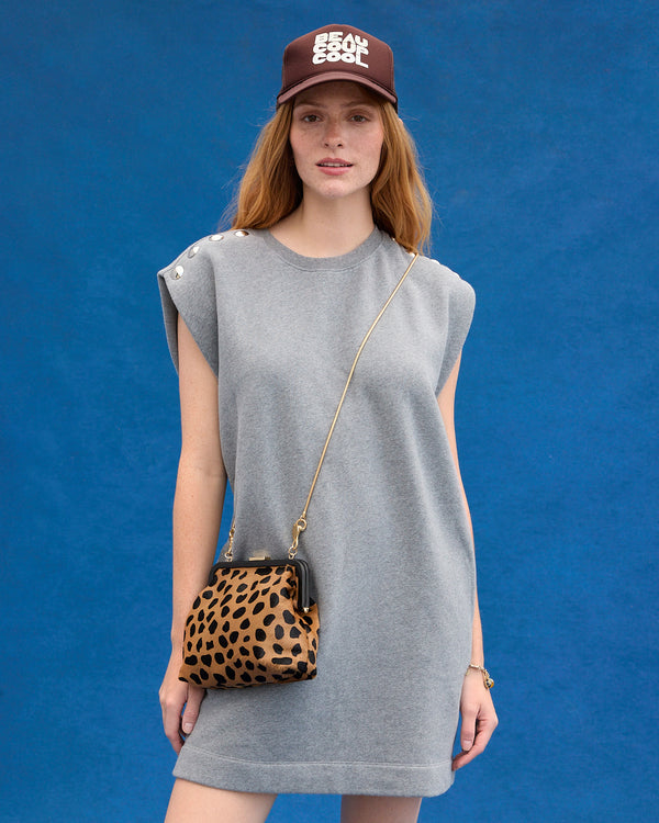Model wearing the Le Vest Dress and Beaucoup Cool Trucker Hat. 