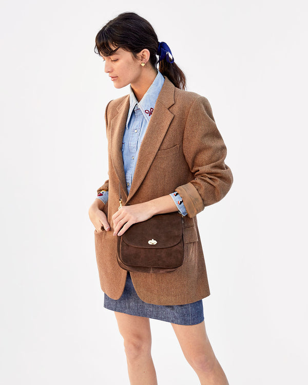 Danica wearing the Chocolate Suede Turnlock Louis crossbody