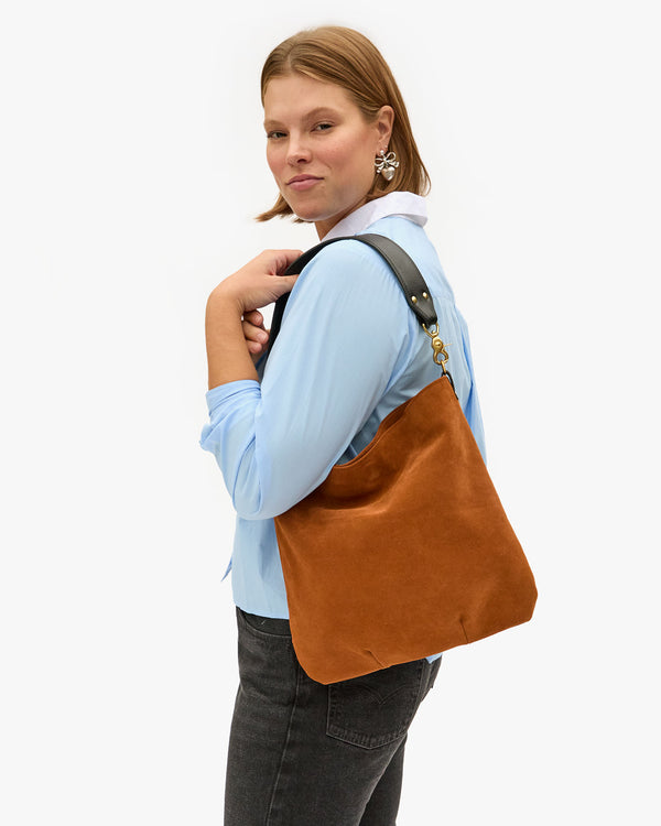 Sonnie wearing the Chestnut Suede Veronique on her shoulder