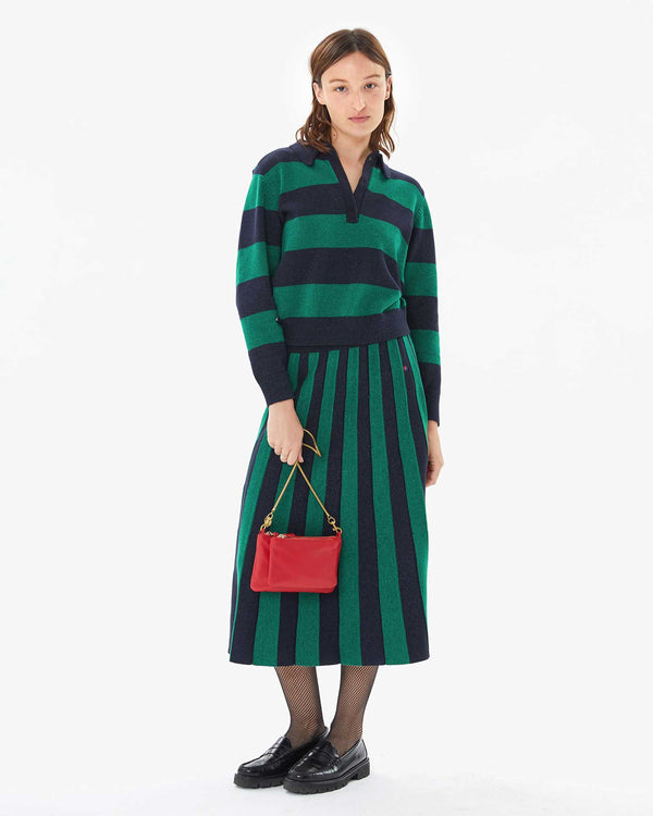 Zoe wearing the Navy & Green Stripe Heloise Polo Sweater with the Navy & Green Stripe Heloise Accordion Skirt