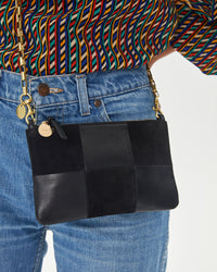 Close Up View of Aurelia wearing the Black Suede & Nappa Wallet Clutch with Tabs as a crossbody