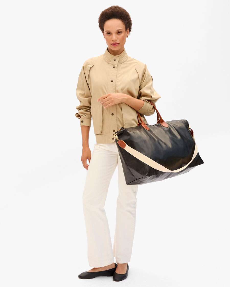 Weekender on model's arm