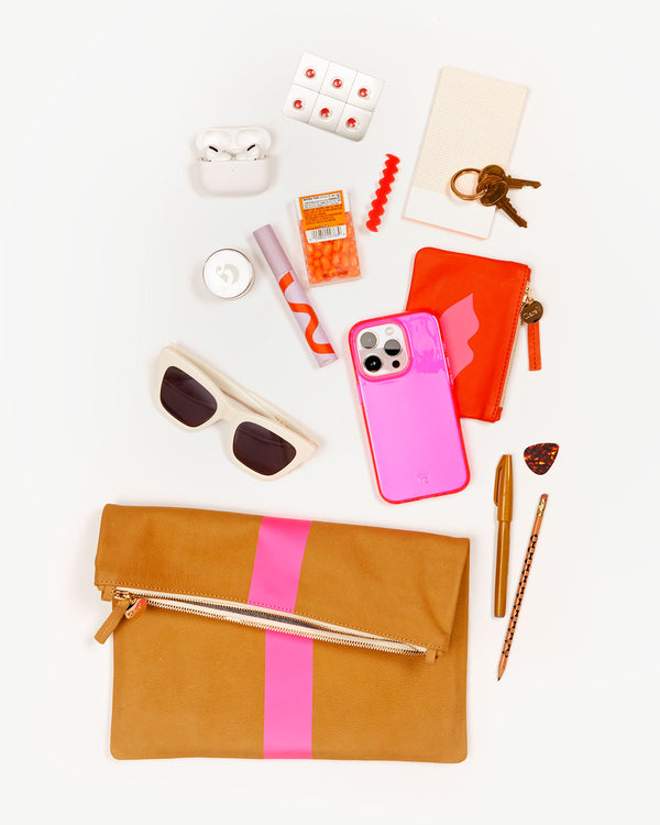 Foldover Clutch w/ Tabs with a selection of items that fit inside