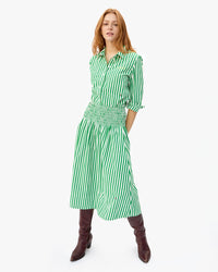 haley with her hands behind her waist. shes wearing the Green & Cream Stripe zoe skirt