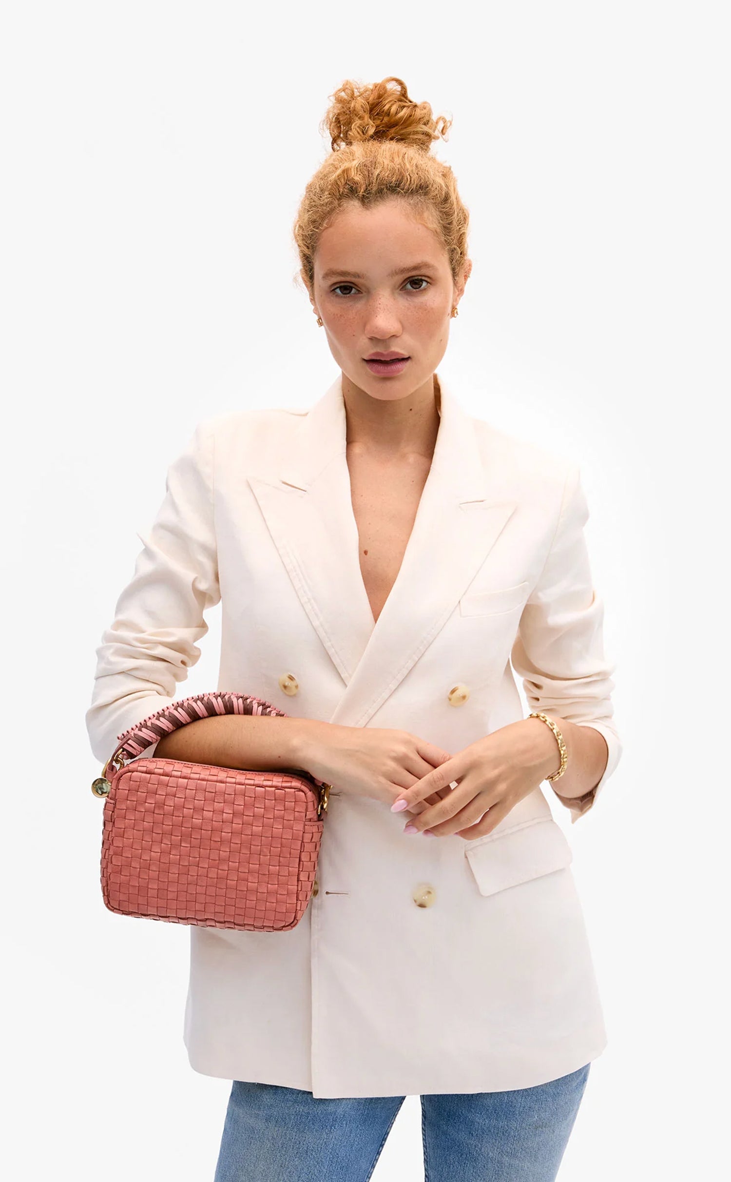 Model carrying a midi sac with the Braided Top Handle.