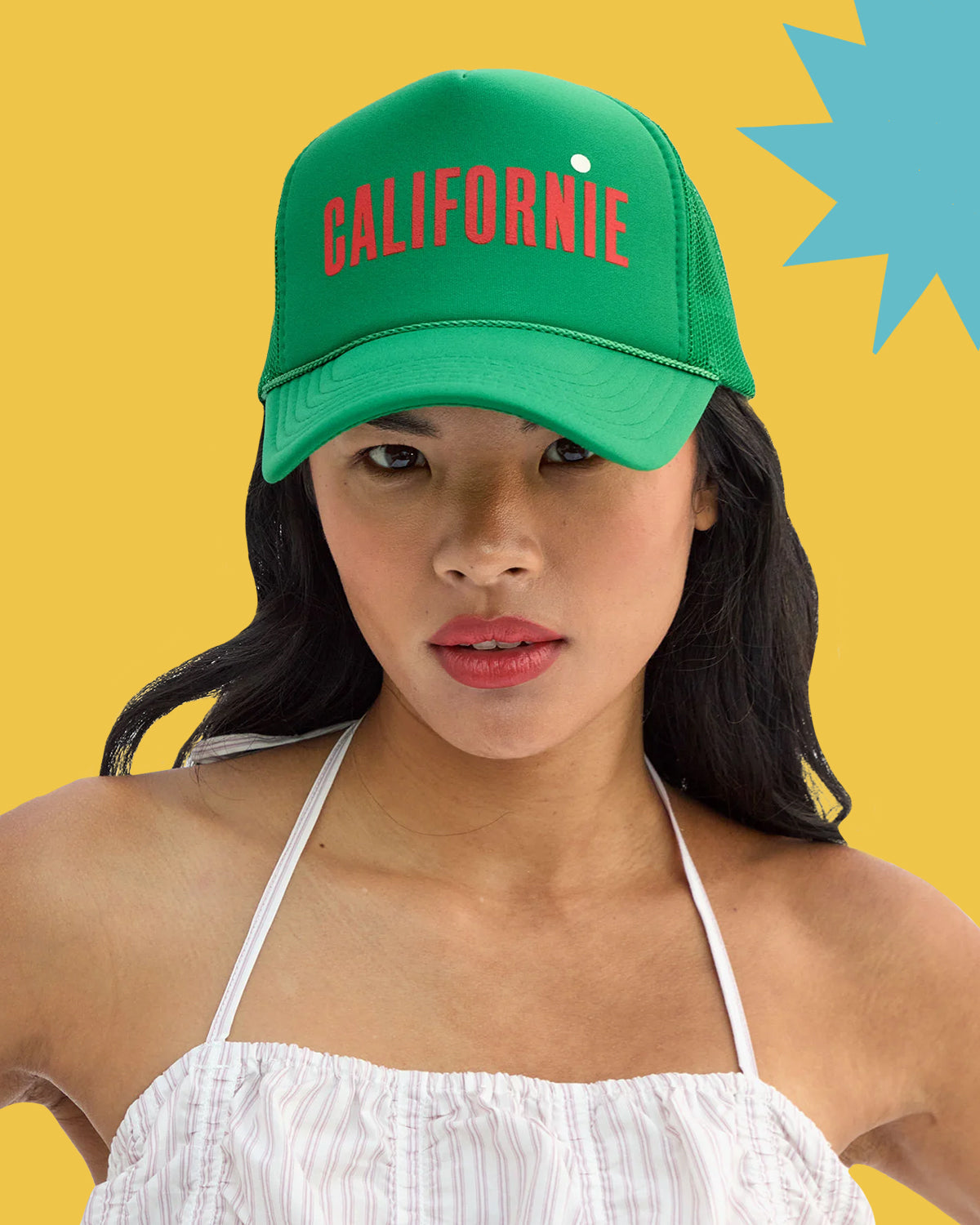 Model wearing the Green Californie Trucker Hat.