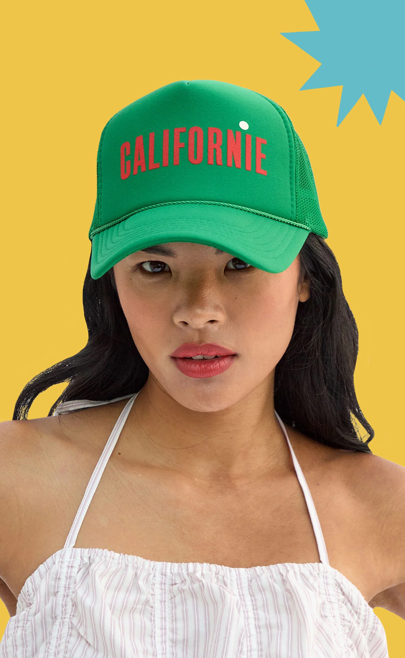 Model wearing the Green Californie Trucker Hat.
