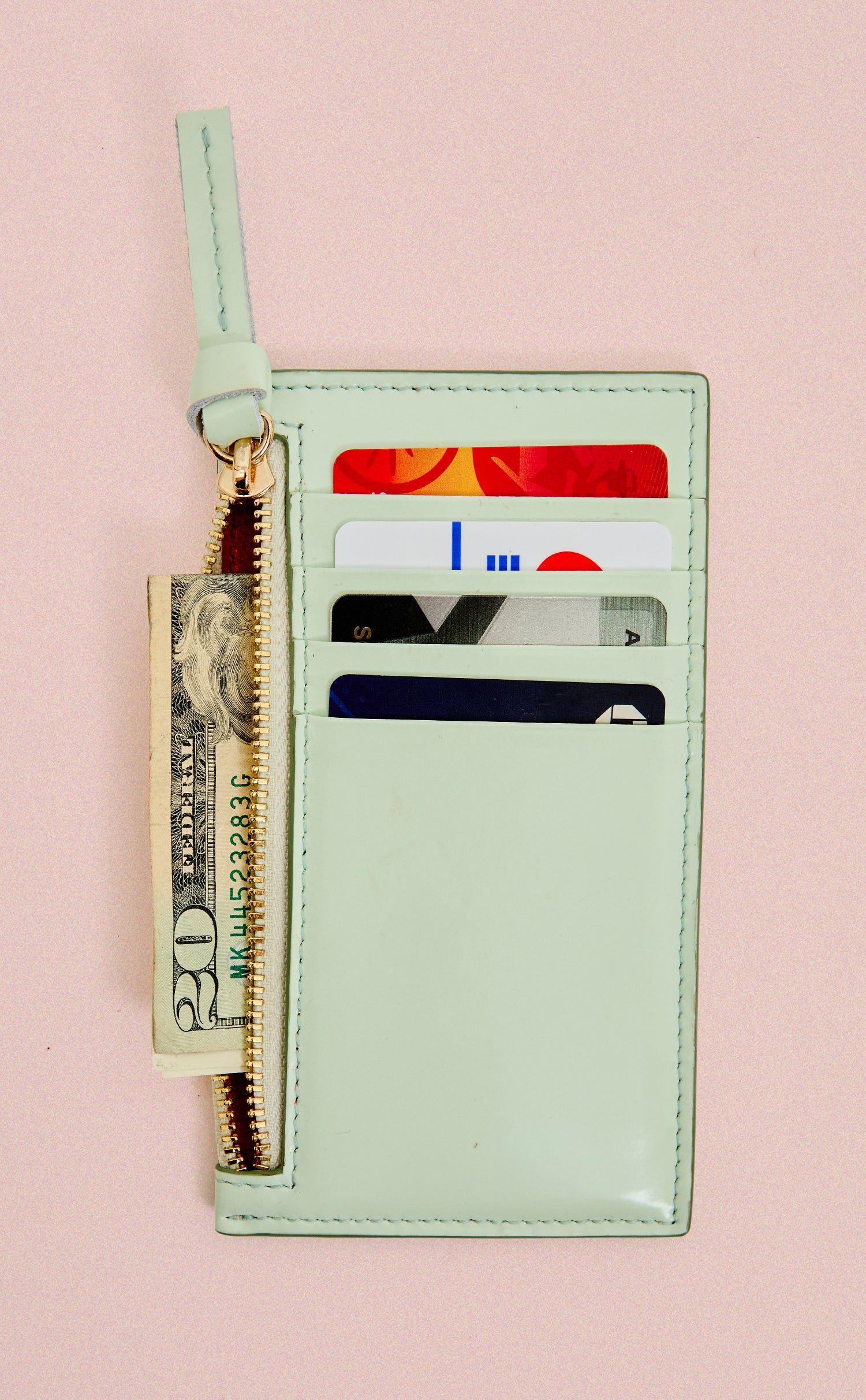 Mist Card Zip Wallet shown with cards and money inside. 