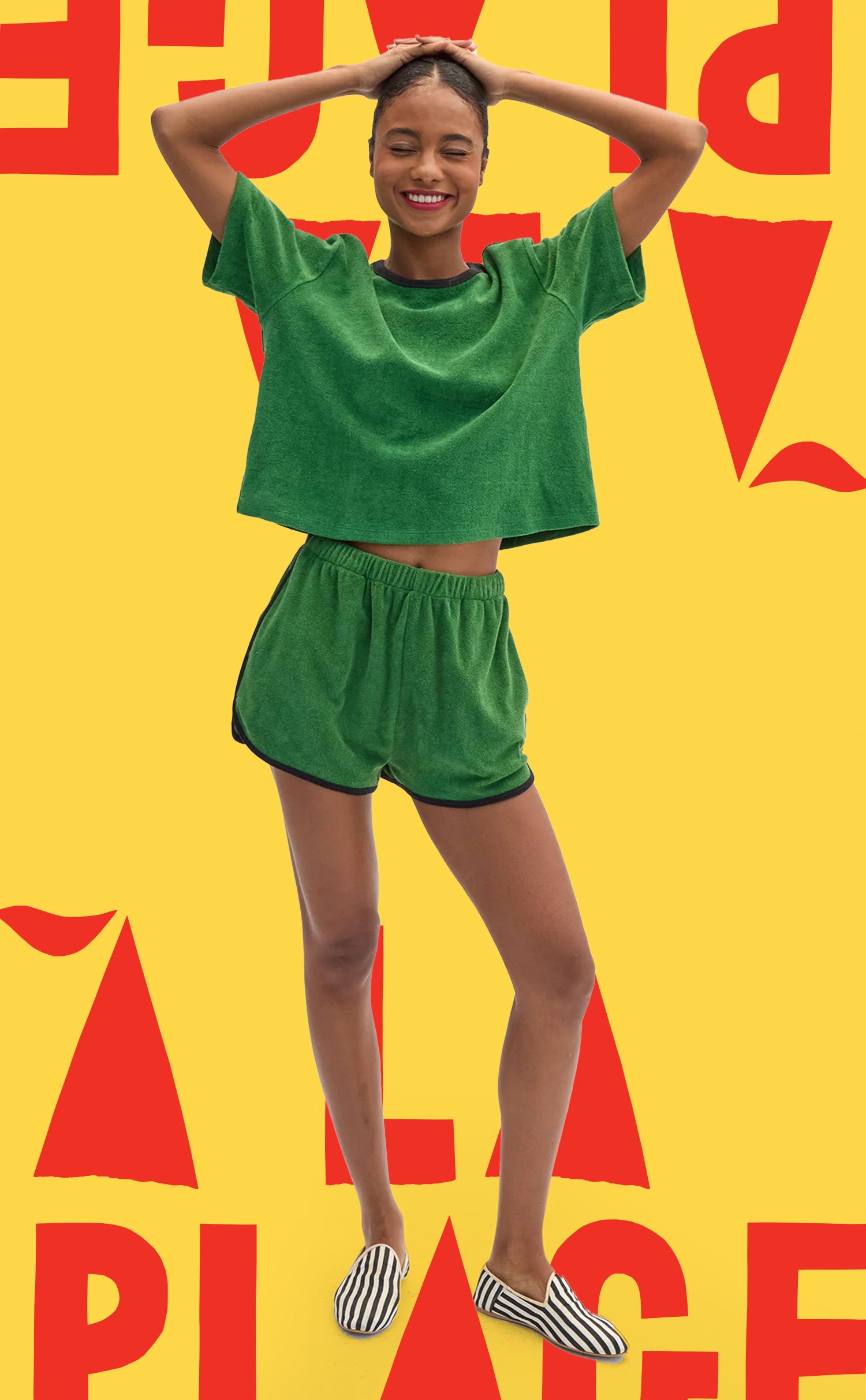 Model wearing La Plage Tee in Basil and matching La Plage Shorts. 