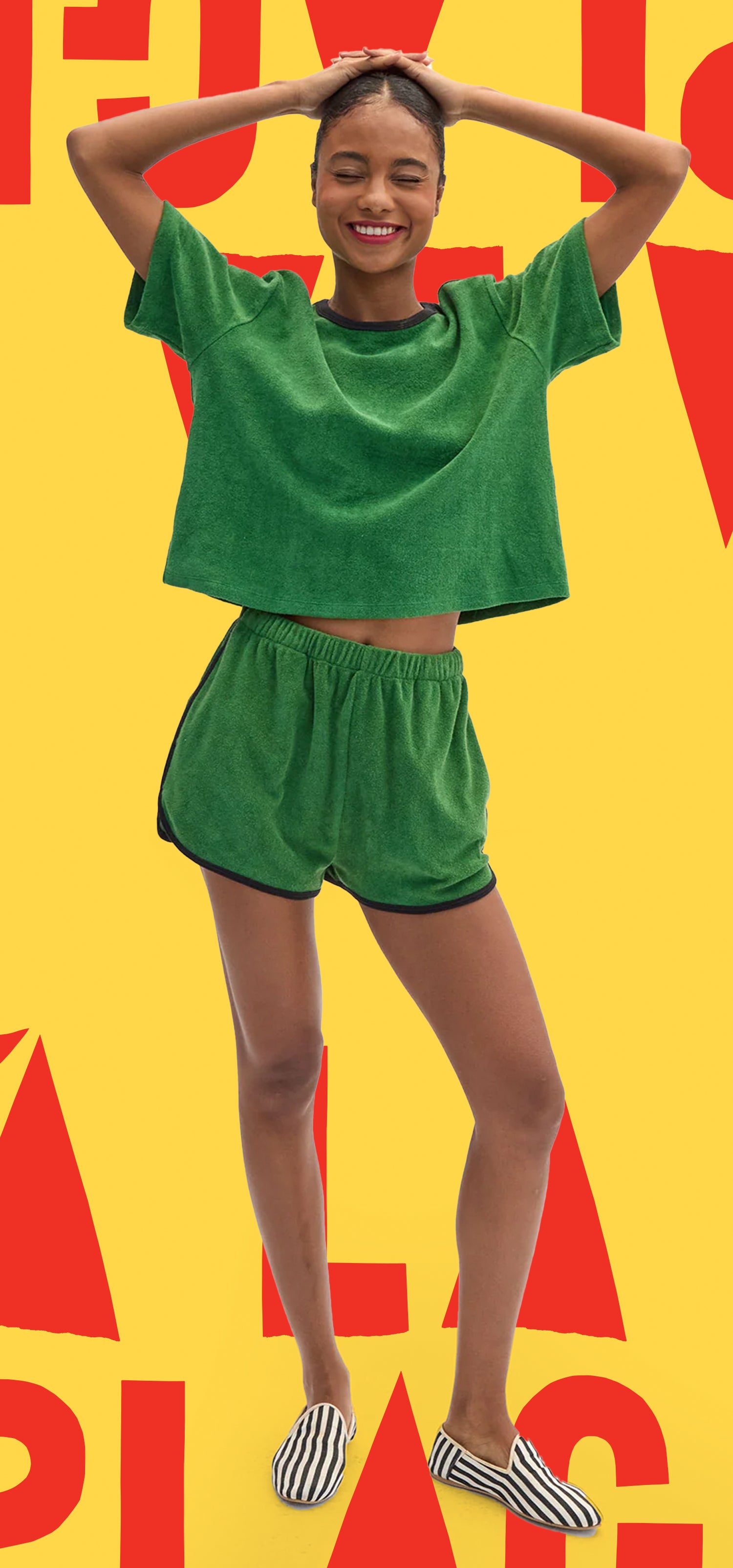 Model wearing La Plage Tee in Basil and matching La Plage Shorts. 