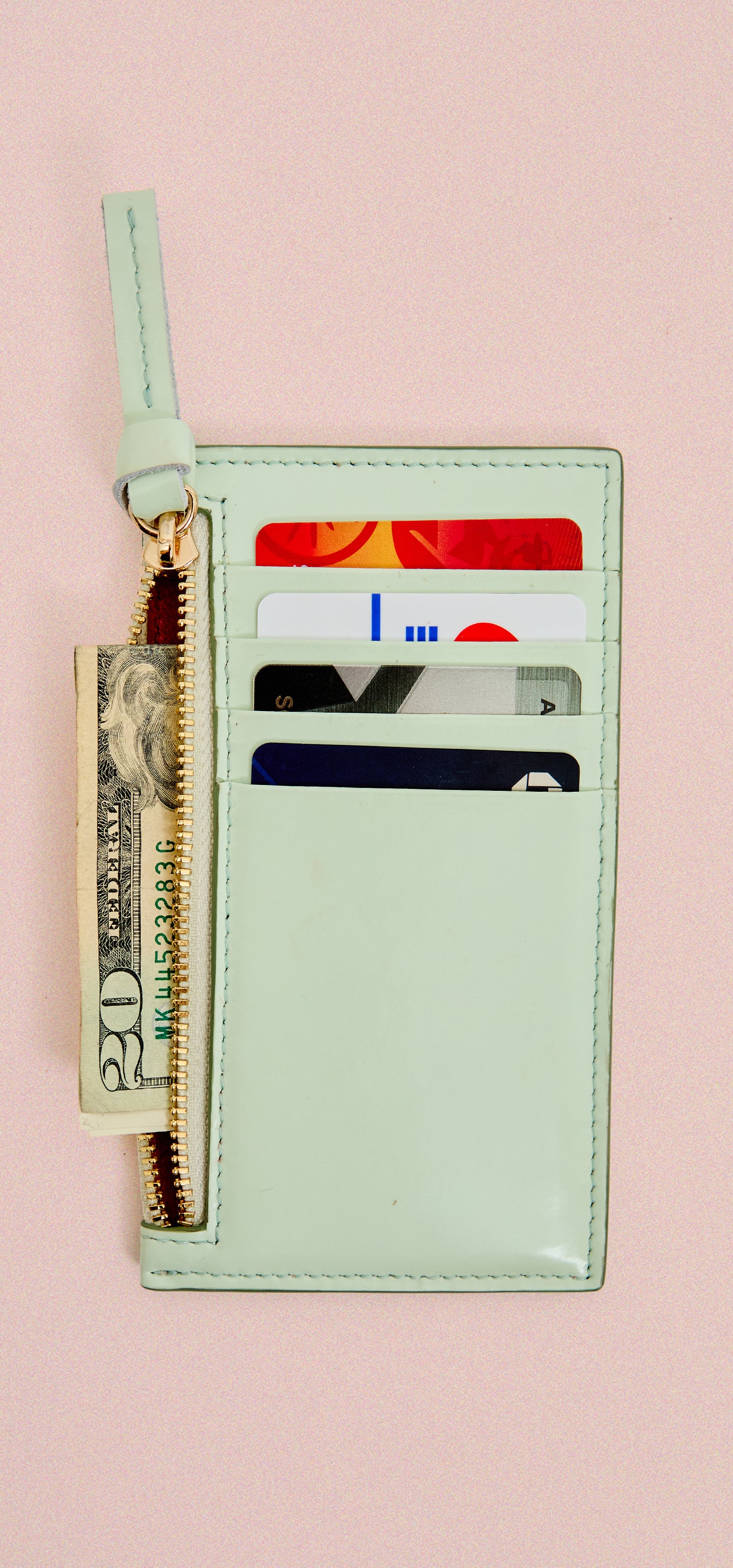 Mist Card Zip Wallet shown with cards and money inside. 