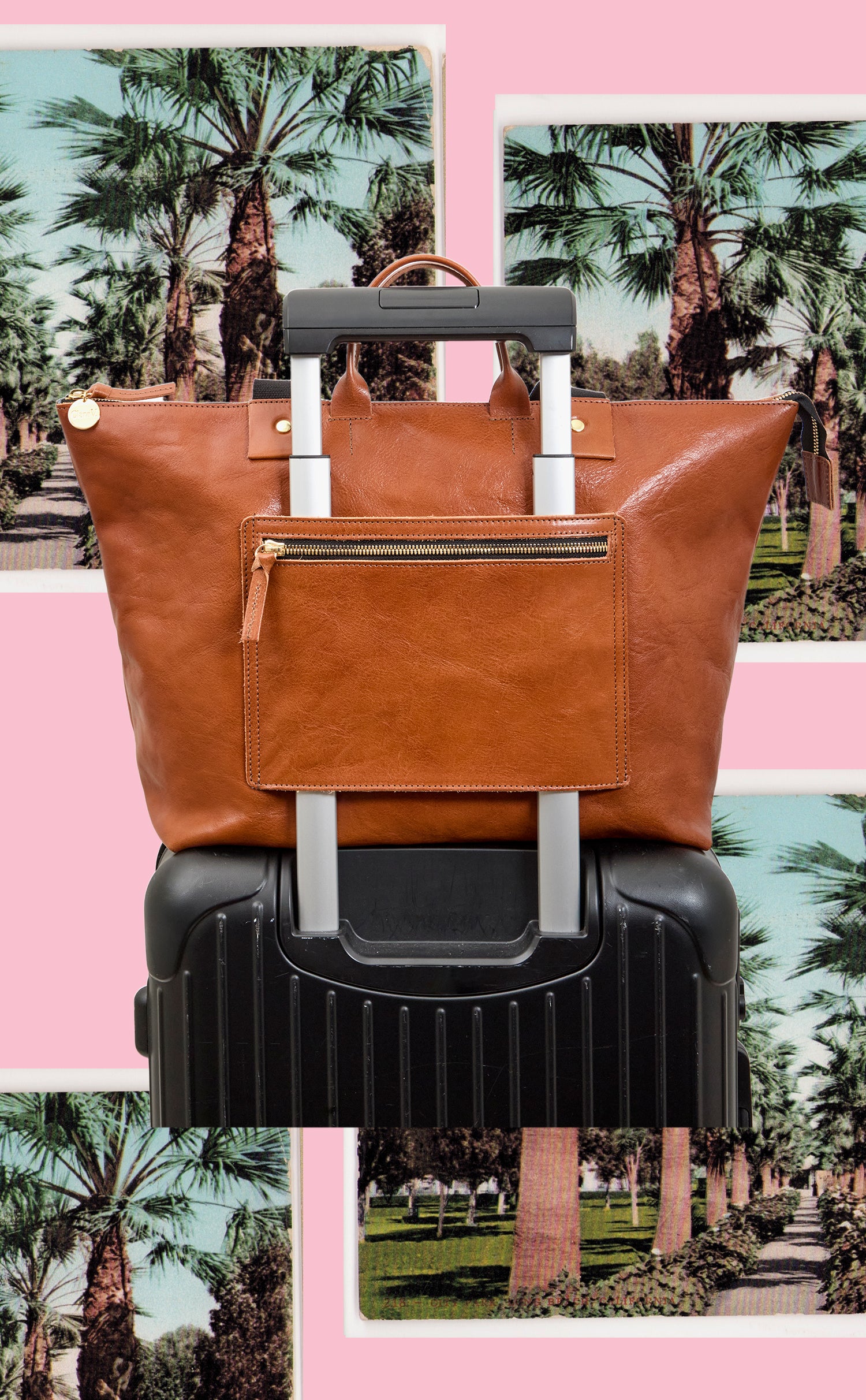 Miel Le Zip Sac with Travel Pocket over the handles of a luggage. 