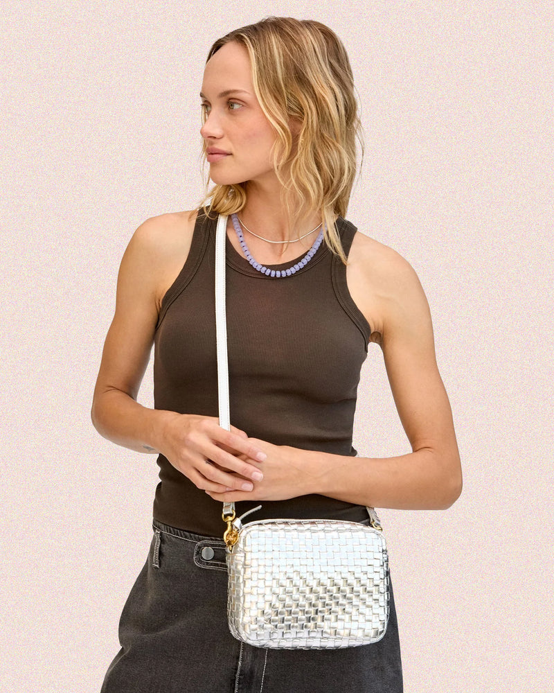 Model carrying the Silver Woven Midi Sac. 