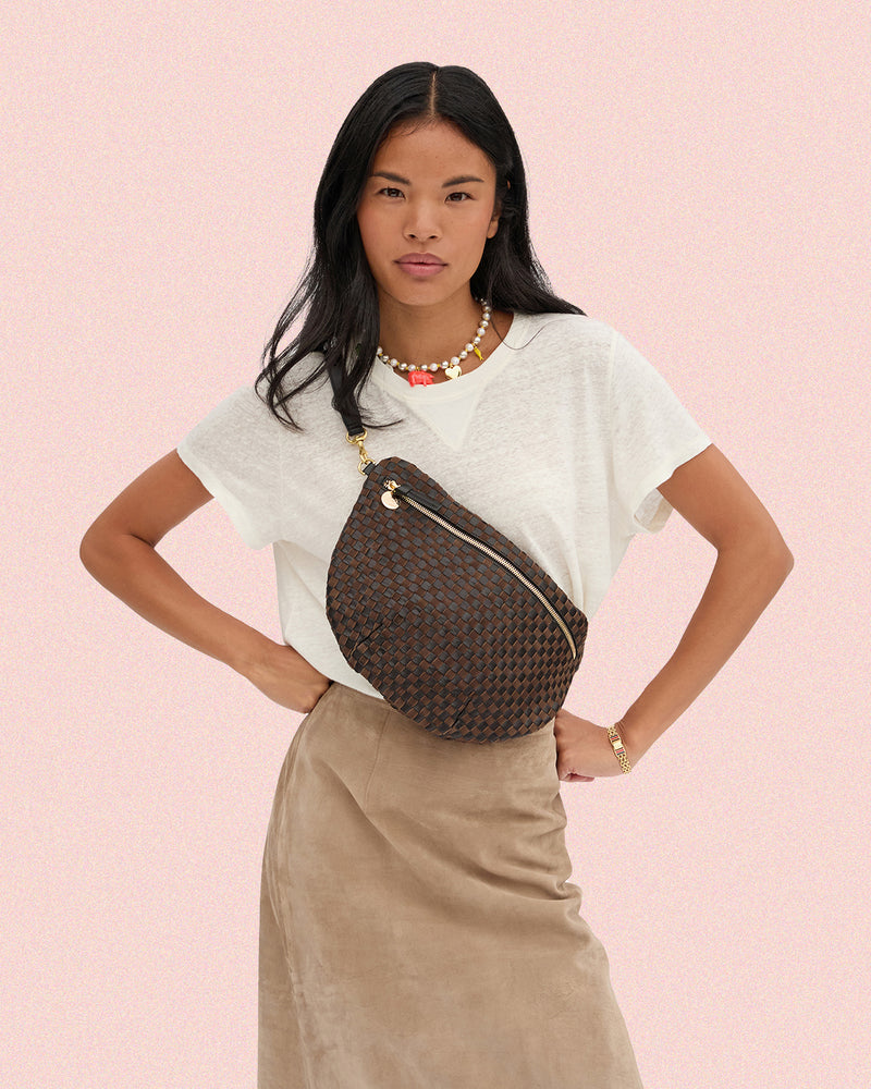 Model carrying the Black and Chocolate Woven Checker Grande Fanny.