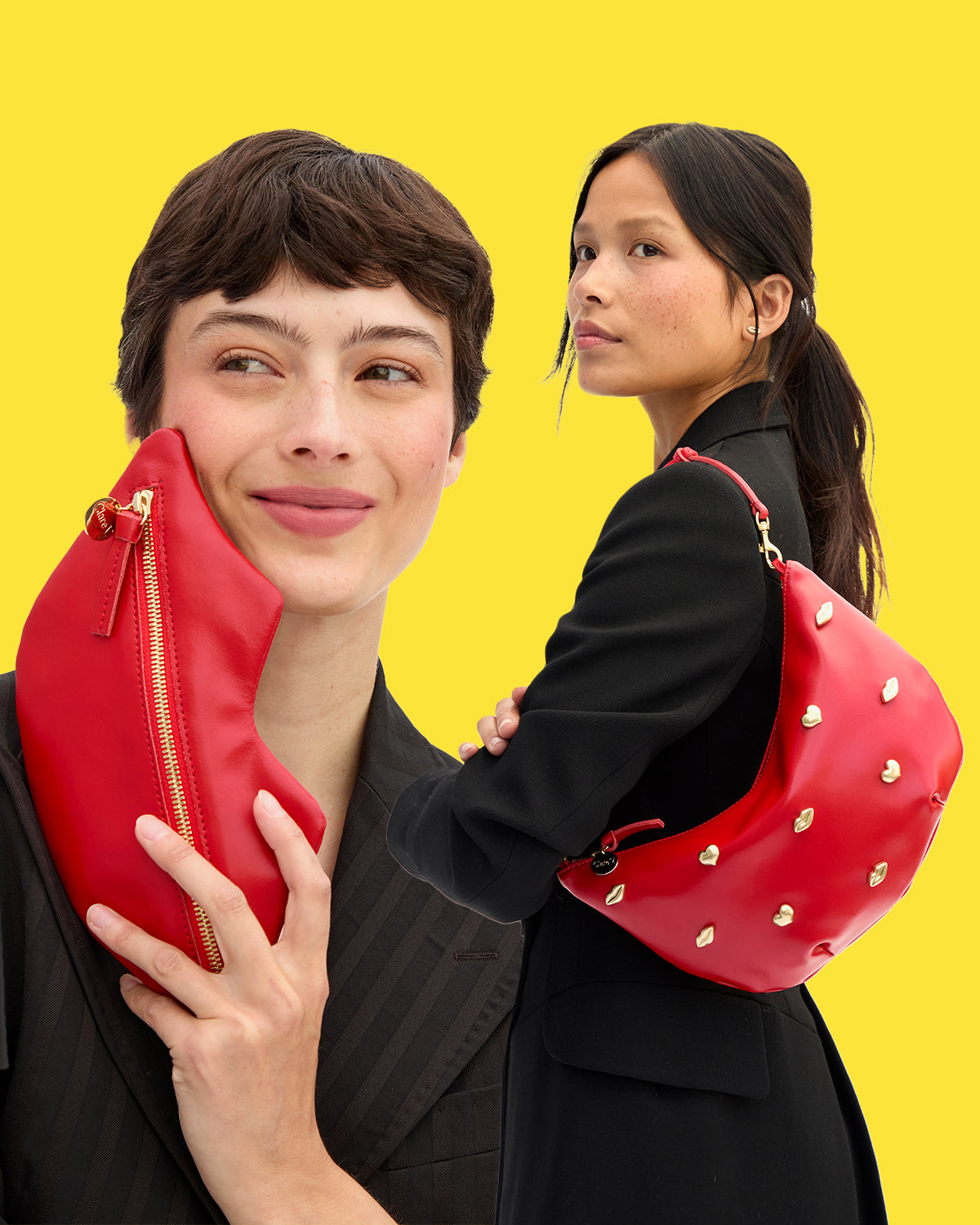 Model holding the Lips Flat Clutch and Super Red w/ XO Studs Lune. 