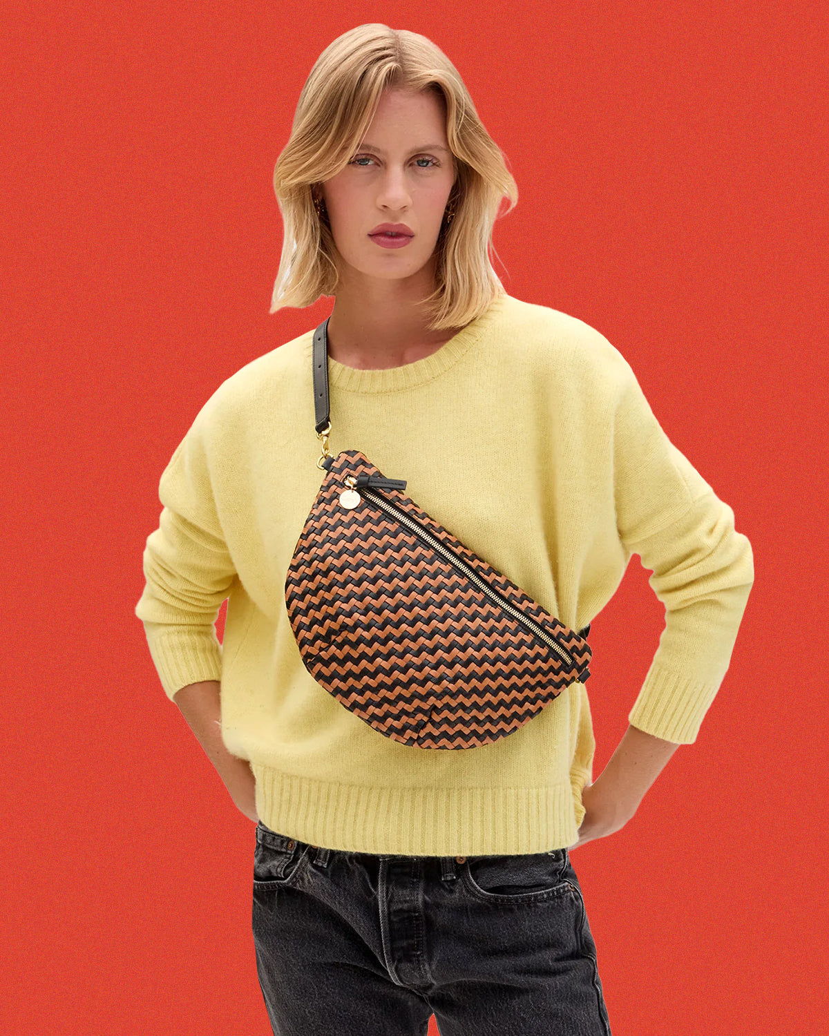 Model carrying the Black/Natural Woven Zig Zag Grande Fanny.