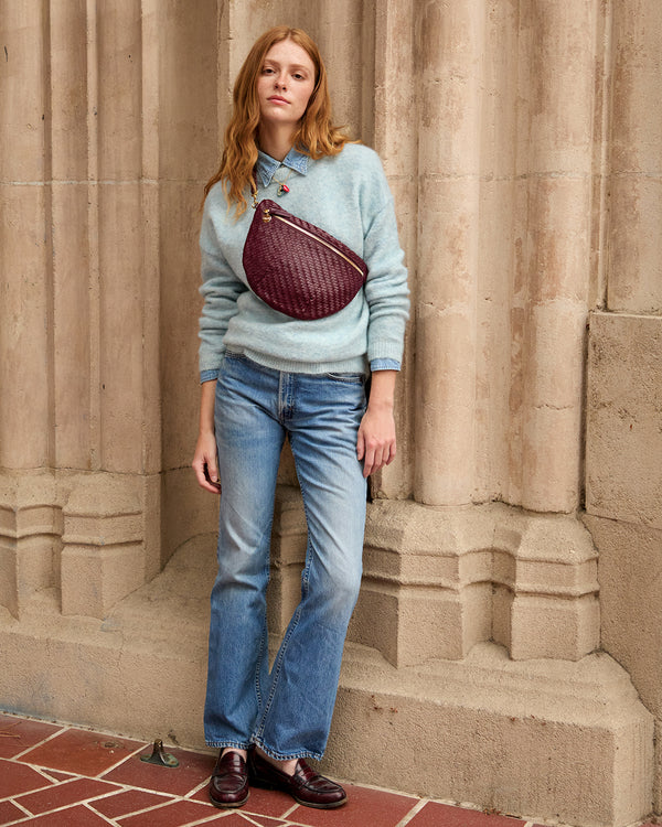 Model carrying the Cassis Woven Zig-Zag Grande Fanny.