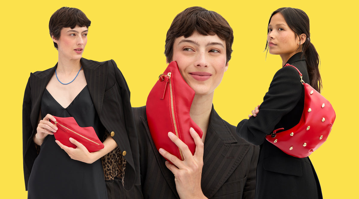 Model holding the Lips Flat Clutch and Super Red w/ XO Studs Lune. 