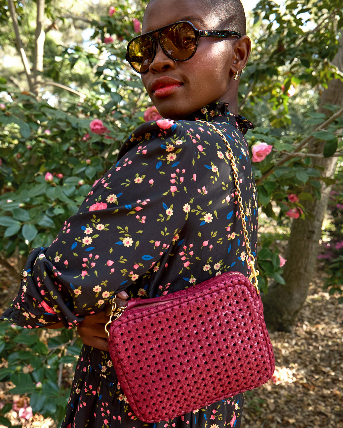 Model wearing the Plummy Rattan with Chain Shoulder Strap.