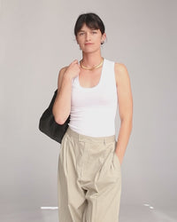 Danica Wearing The Black Zig Zag Bando Over Her Shoulder and Winking At The Camera