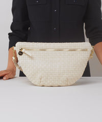 Model shows what fits in the Cream Woven Checker Grande Fanny