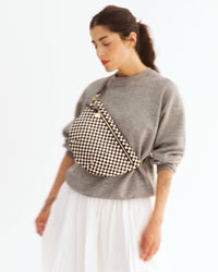 Gia takes her phone out of her Grande Fanny and takes a selfie